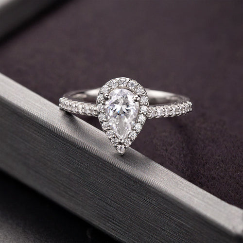 Whispers of Eternity Pear Shape Halo Style Moissanite Engagement Ring in Sterling Silver