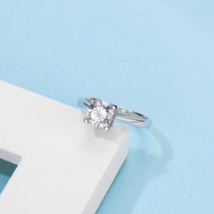 Sublime Solitaire Serenity Four Prong Set Round Moissanite Engagement Ring in Sterling Silver