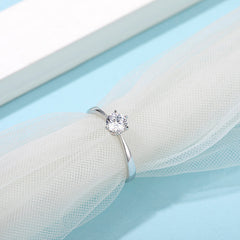 Classic Tapered Shank Six Prong Set Round Solitaire Moissanite Engagement Ring in Sterling Silver