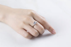 Sublime Solitaire Serenity Four Prong Set Round Moissanite Engagement Ring in Sterling Silver