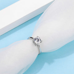 Sublime Solitaire Serenity Four Prong Set Round Moissanite Engagement Ring in Sterling Silver